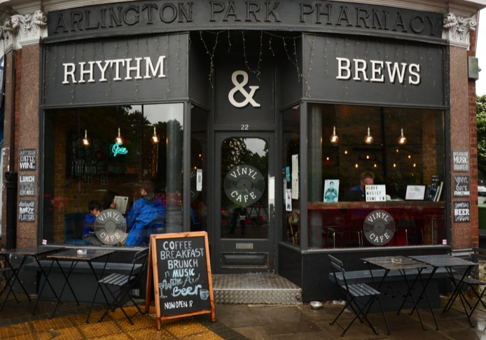 Patrons enjoying craft beer while watching live band perform on intimate stage